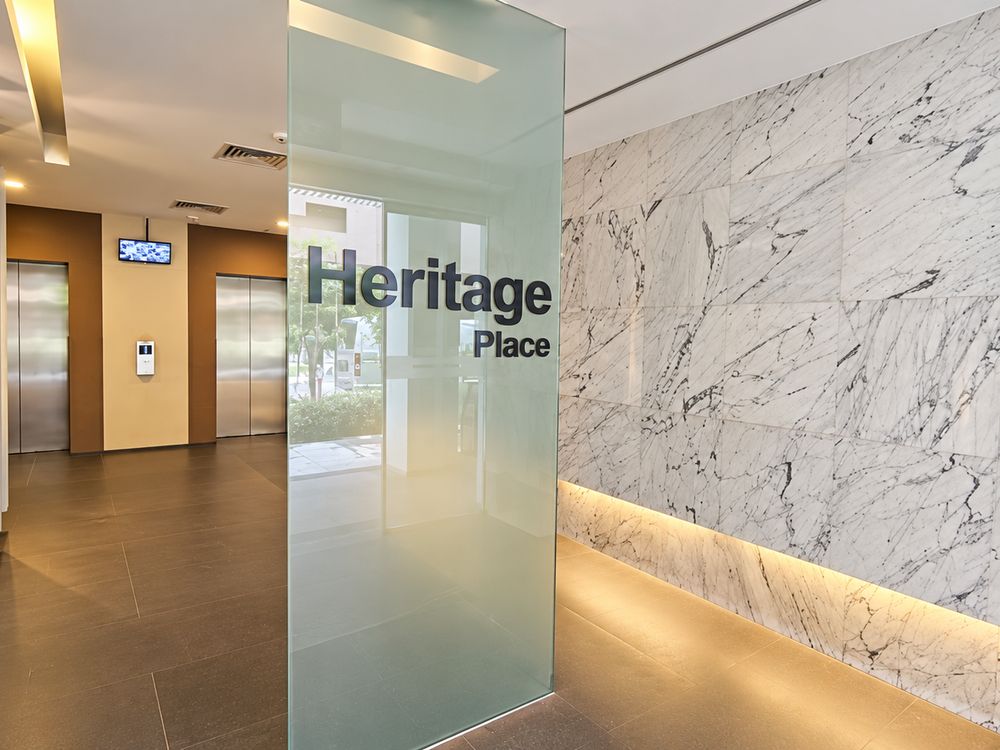 Heritage Place lobby with marble wall and lifts